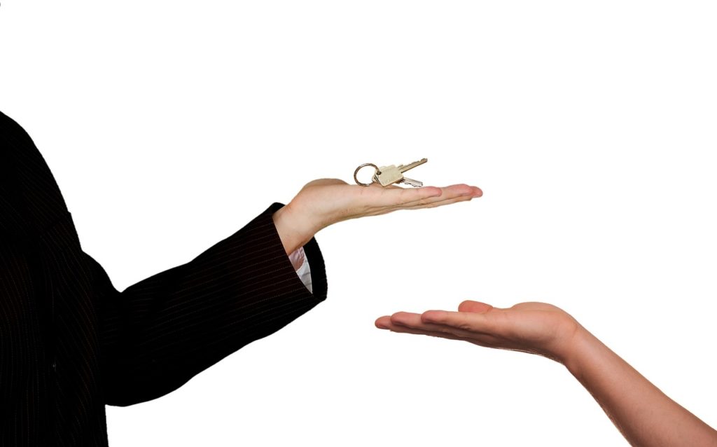 hand holding keys to borrower